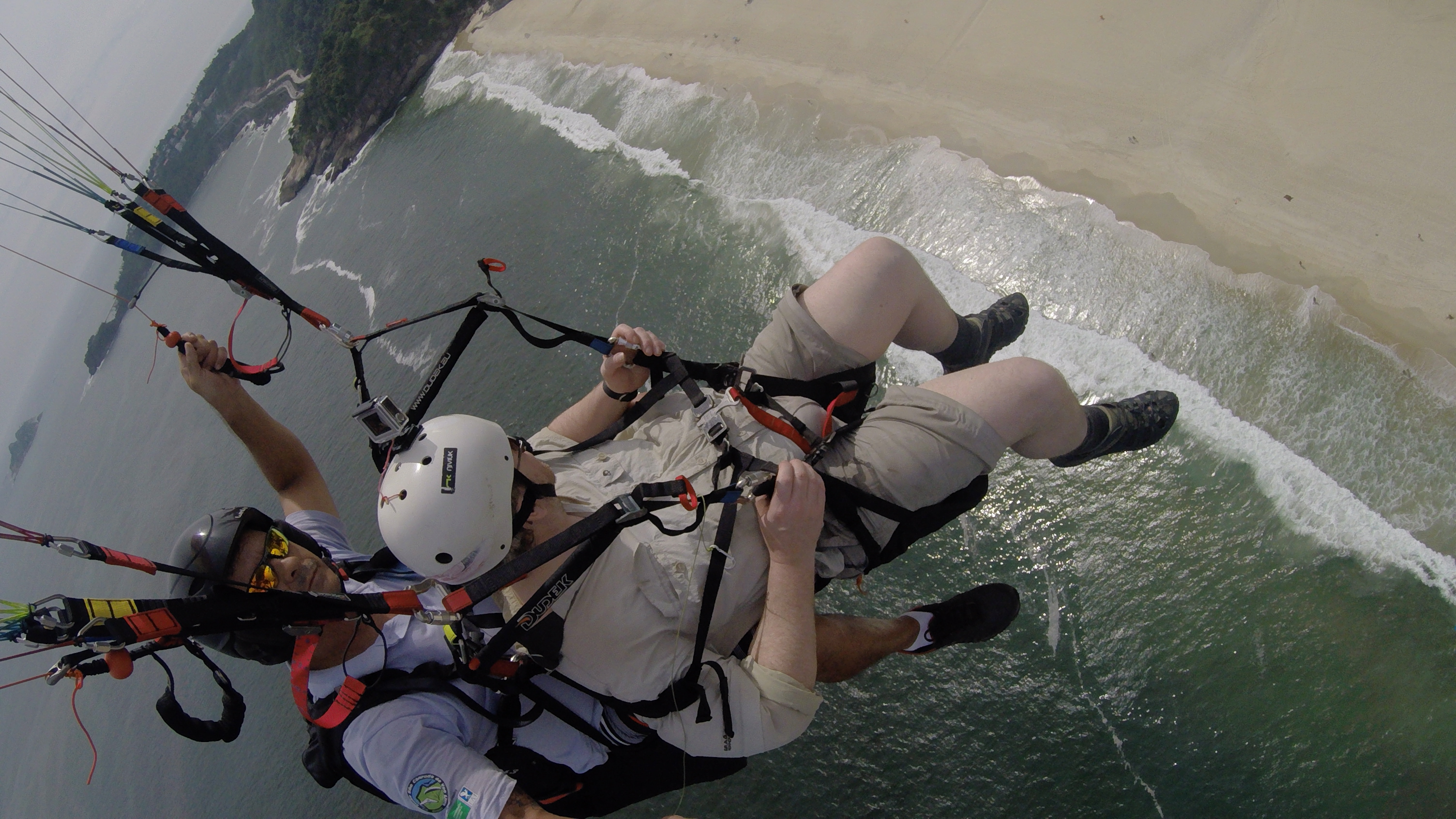 Flying above the coast from the hill and the breakers to the beach