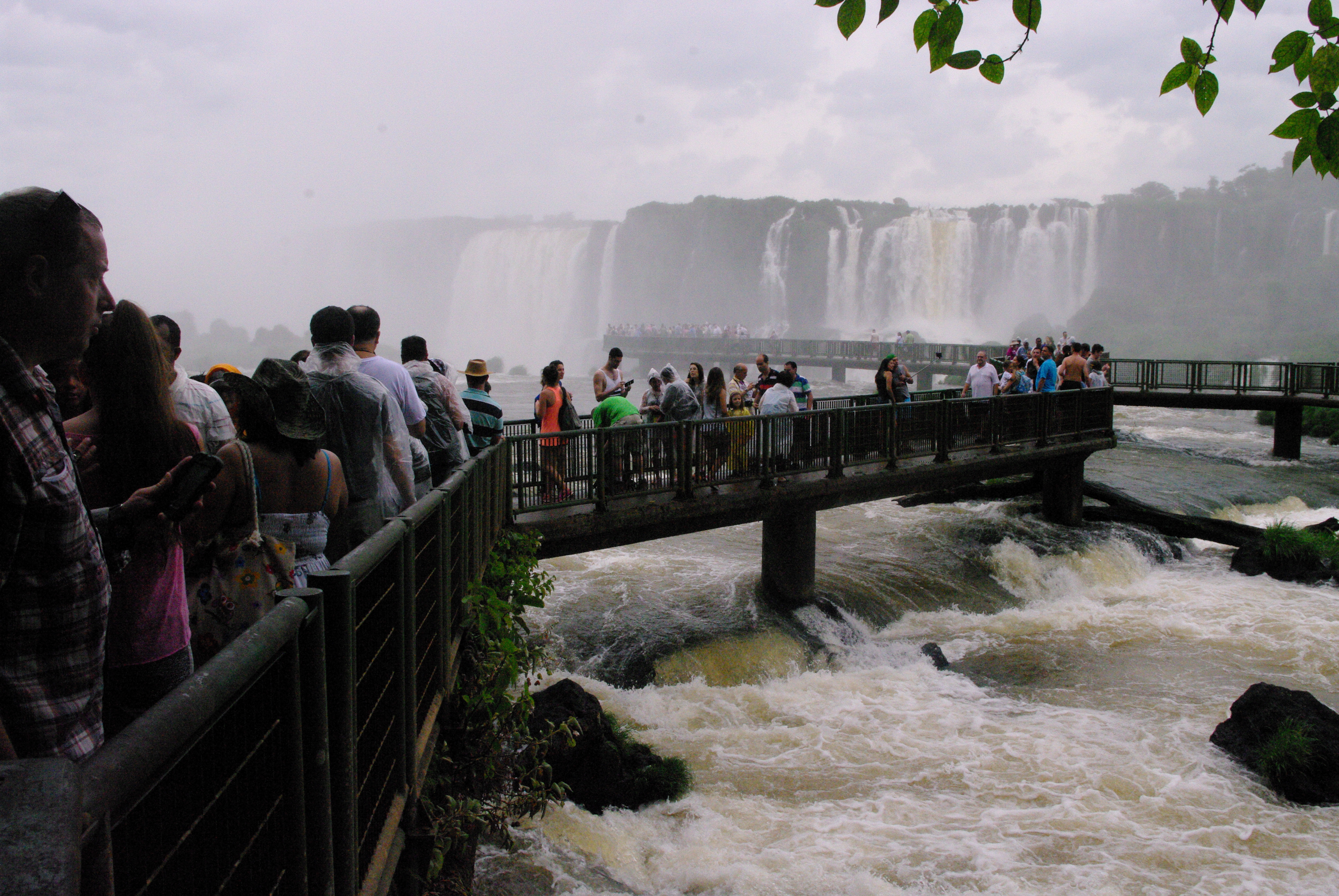 Iguazu Falls, Brazil. The platform, full of people, that forms a Walkway in front of the foot of the falls