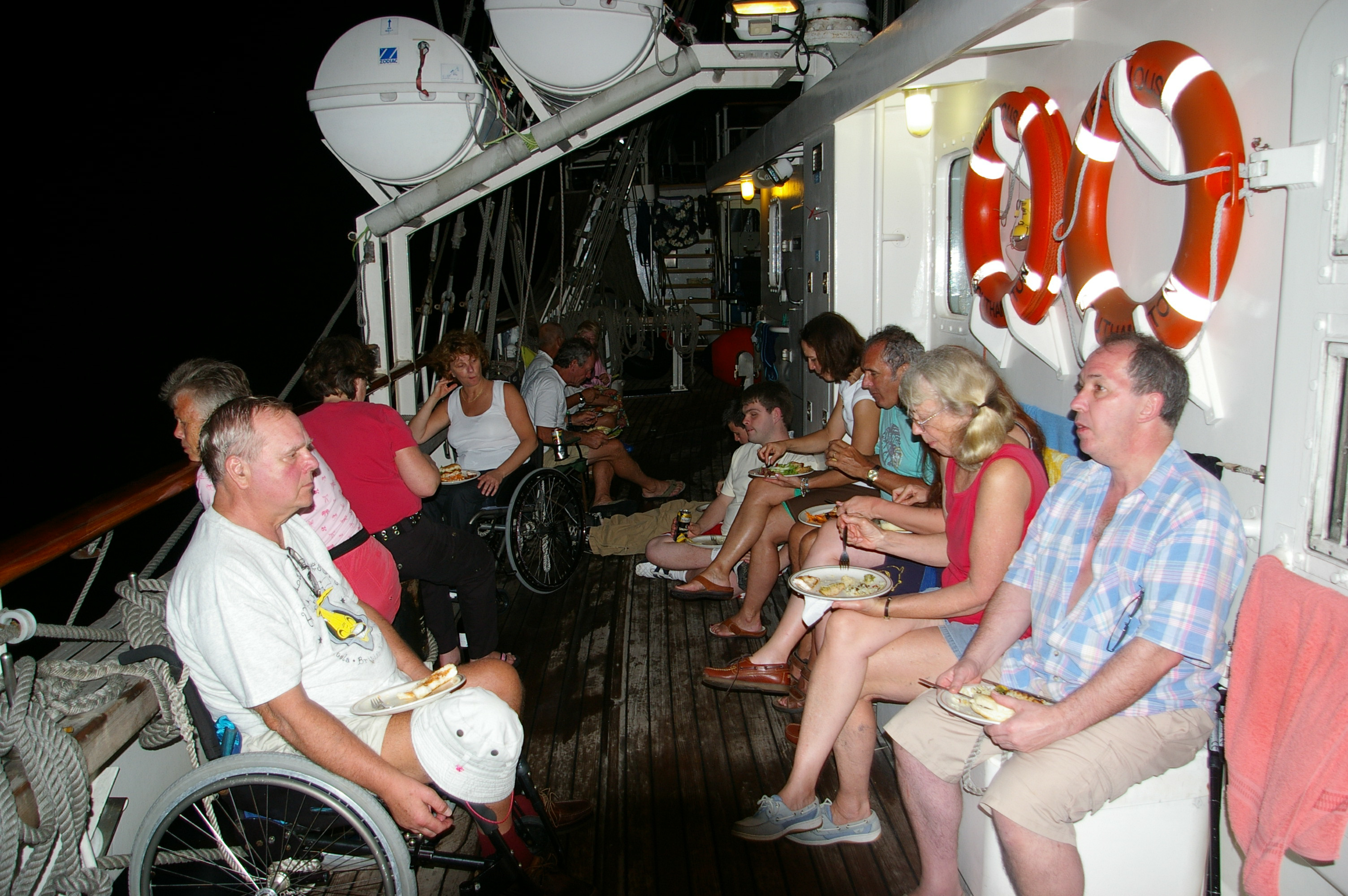 Some of us sitting around on the main deck enjoying an evening  barbecue