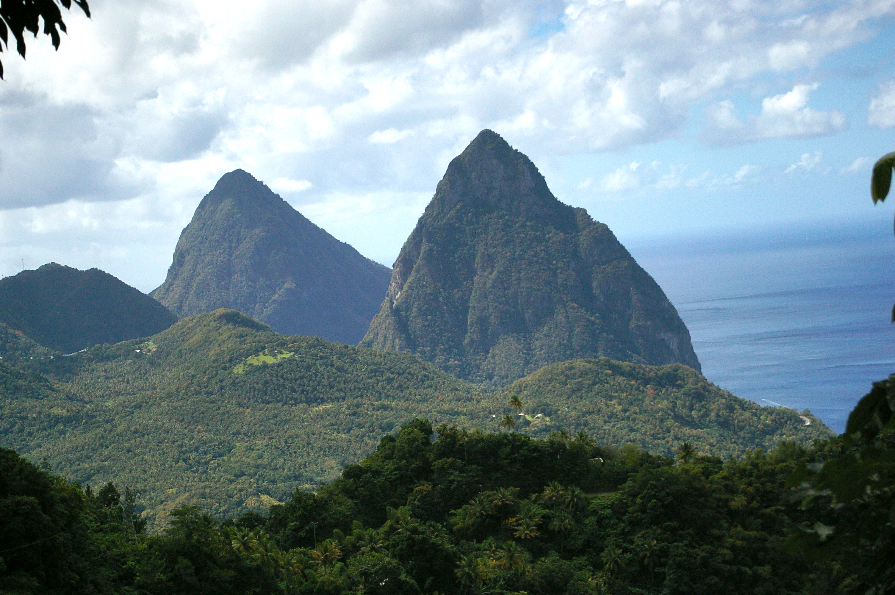 The Pitons from the hills on the northern side of Soufriere Bay, with Gros Piton visible through the gap between the southern hills and Petit Piton