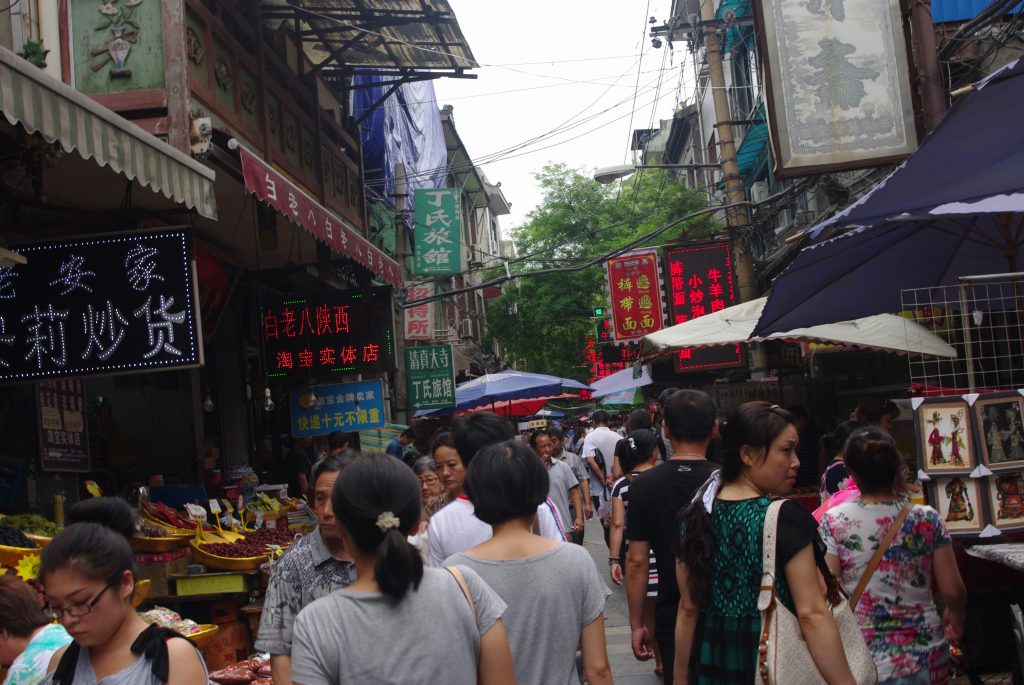 View along the busy main street in the Xi'an Muslim Quarter, with all its stalls and old buildings